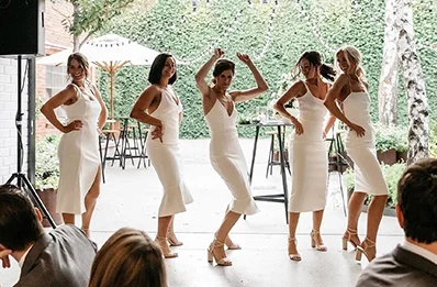 Outdoor garden wedding with catered grazing table and champagne 