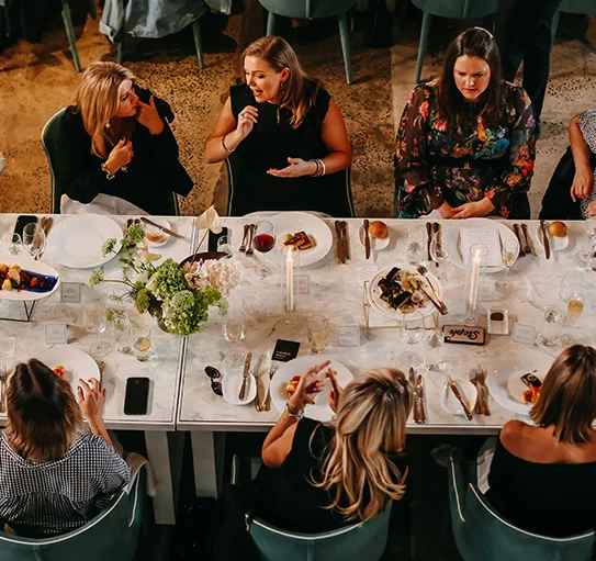 Chef plating gourmet canapés for corporate catering event in Melbourne 